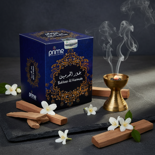 Bakhoor Al Harmain incense box by Prime Fragrances styled with jasmine flowers and sandalwood in soft blue light